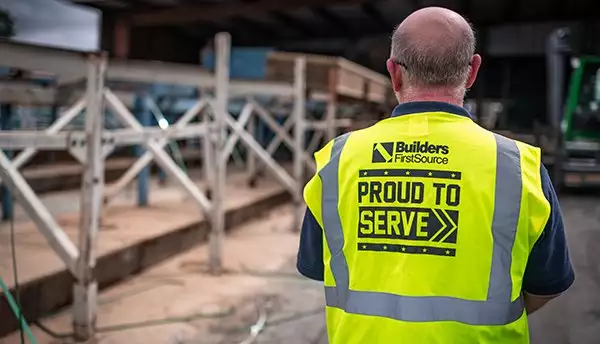 The Back of a BFS Worker and Veteran Wearing a "Proud to Serve" Safety Vest