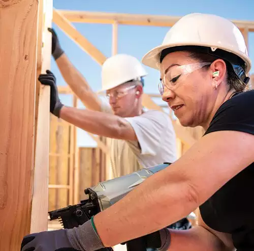 Workers at Jobsite Constructing House Framing